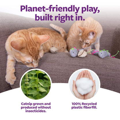 Cat playing with a SmartyKat Skitter Critters catnip mouse toy